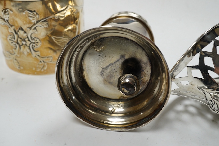 An Edwardian silver 'Reynold's Angels' silver canister, William Comyns, London, 1902, 90mm, together with a silver table perpetual lighter, silver bonbon basket and silver ring box. Condition - poor to fair